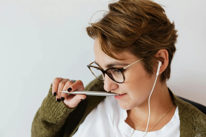 a woman in glasses holding a cell phone to her ear, trending on pexels, fantastic realism, holding pencil, nursing, with a straw, avatar image