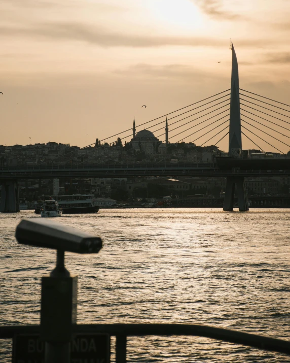 a large body of water with a bridge in the background, pexels contest winner, hurufiyya, turkish and russian, lgbtq, islamic, caught on camera