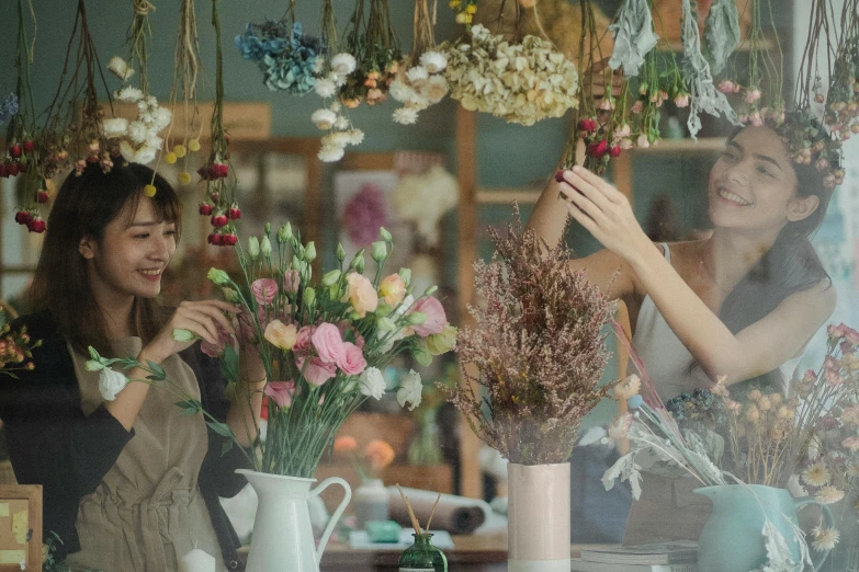 a couple of women standing in front of a window, flower decorations, inspect in inventory image, fan favorite, professional image