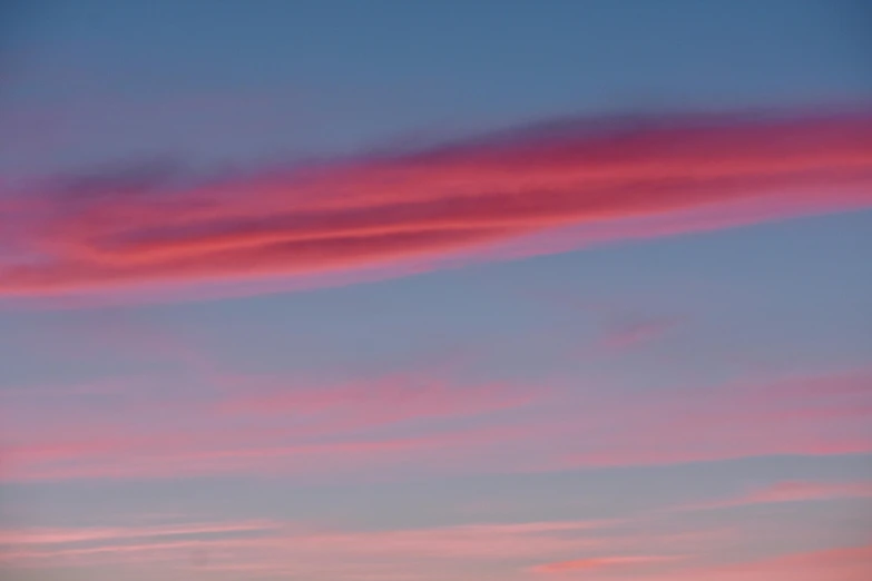 a couple of cows standing on top of a lush green field, inspired by Jan Rustem, unsplash, romanticism, dramatic pink clouds, photography shot at blue hour, abstract photography, panorama view of the sky