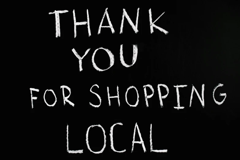 a blackboard with the words thank you for shopping local, notan, single image, black, tyler west
