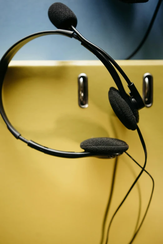 a pair of headset sitting on top of a table, flickr, ap news photo, panel, office, staples