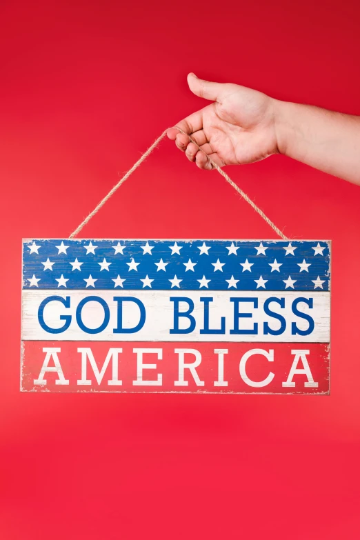 a hand holding a sign that says god bless america, shutterstock, folk art, 🚀🌈🤩, decoration, young almighty god, 🚿🗝📝