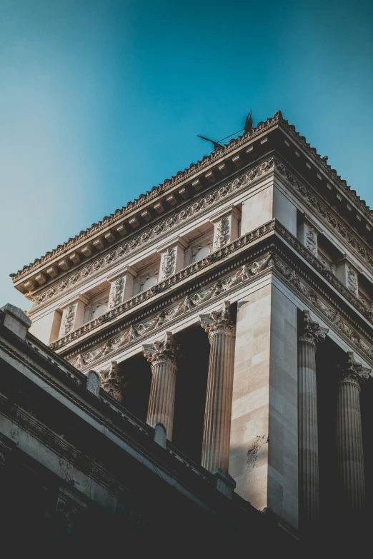 a tall building with a clock on top of it, by Adam Marczyński, unsplash contest winner, neoclassicism, arches adorned pillars, ancient greek temple, profile image, brown