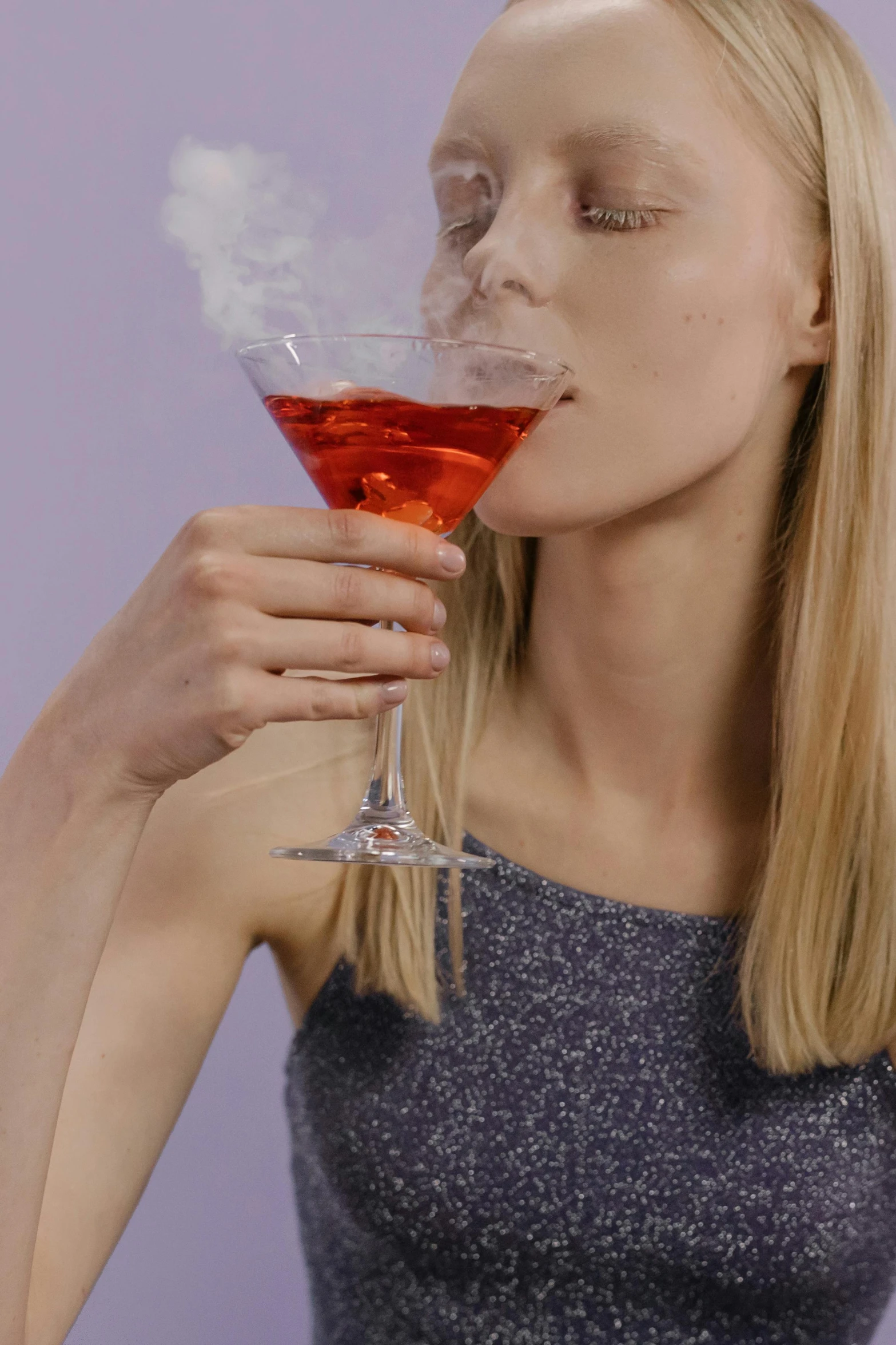 a woman sitting at a table with a glass of wine, inspired by Cosmo Alexander, violet spike smoke, mixing drinks, licking out, profile image