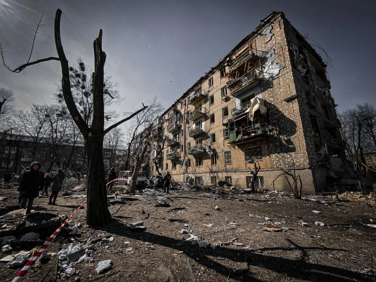 a group of people standing in front of a building, a photo, by Adam Marczyński, unsplash contest winner, auto-destructive art, war in ukraine, belongings strewn about, kremlin towers are destroyed, instagram picture