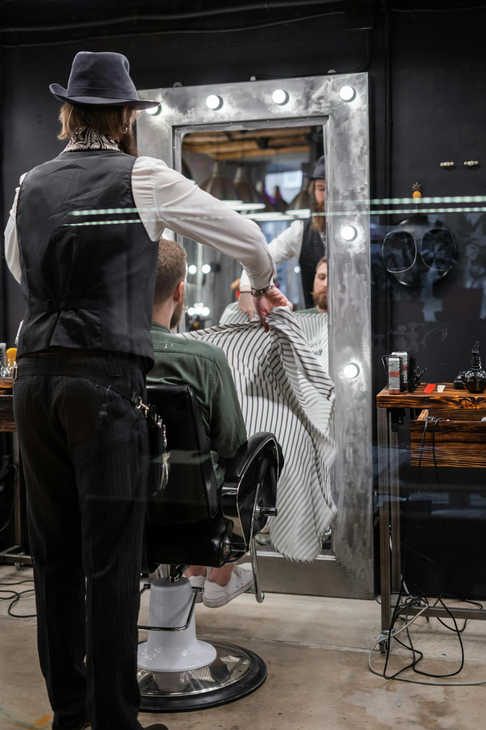 a man getting his hair cut at a barber shop, by Julia Pishtar, trending on unsplash, vertical orientation, thumbnail, with his back turned, minn