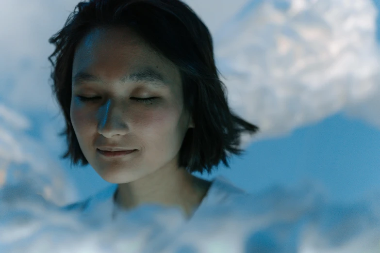 a close up of a person looking at a cell phone, inspired by Ai Xuan, video art, mountains made out of icebergs, beautiful himalayan woman, 2 0 2 1 cinematic 4 k framegrab, humans sleeping in healing pods