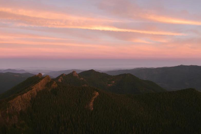 a view from the top of a mountain at sunset, renaissance, evergreen valley, pink skies, landscape photo