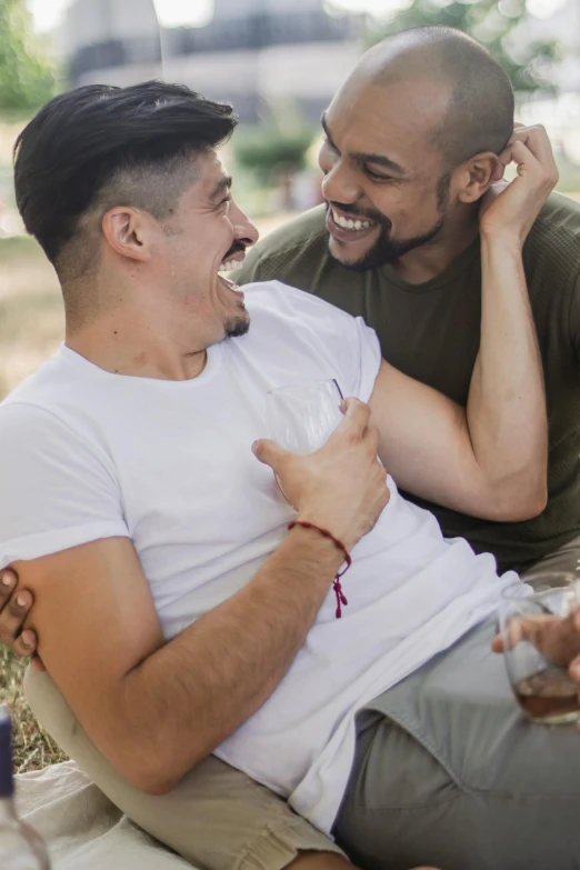 a couple of men sitting next to each other, trending on pexels, renaissance, loving embrace, hispanic, celebrating, gay