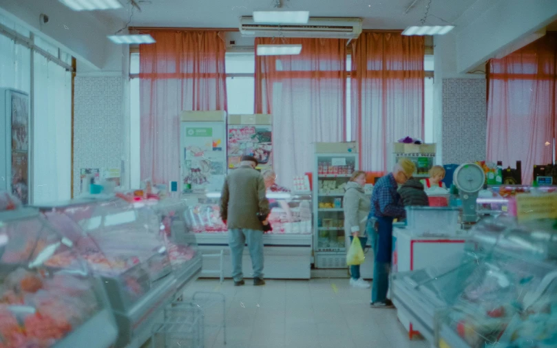 a couple of people that are standing in a store, by Attila Meszlenyi, still from a live action movie, 000 — википедия, sovietwave aesthetic, market stalls