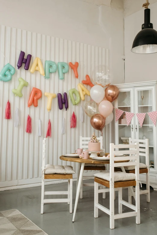 a table that has a bunch of balloons on it, a picture, by Julia Pishtar, shutterstock, cute room, happy birthday, nordic pastel colors, 15081959 21121991 01012000 4k