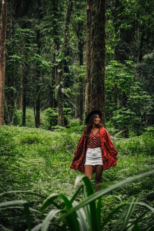 a woman walking through a lush green forest, a portrait, pexels contest winner, sumatraism, forest picnic, portrait of tall, sza, festivals