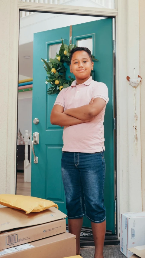 a woman standing in front of a green door, teen boy, in a dark teal polo shirt, maximus jacobs, full body image