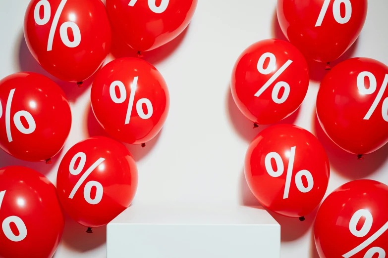 a bunch of red balloons with white numbers on them, by Julia Pishtar, trending on unsplash, hyperrealism, clemens ascher, red scales, crazy colors 1 0 %, on a gray background