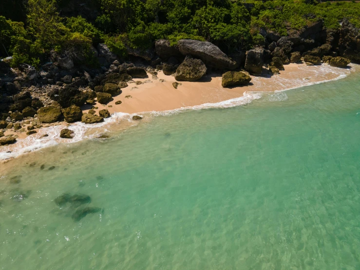 a large body of water next to a sandy beach, pexels contest winner, hurufiyya, puerto rico, abel tasman, flying rocky island, lush surroundings