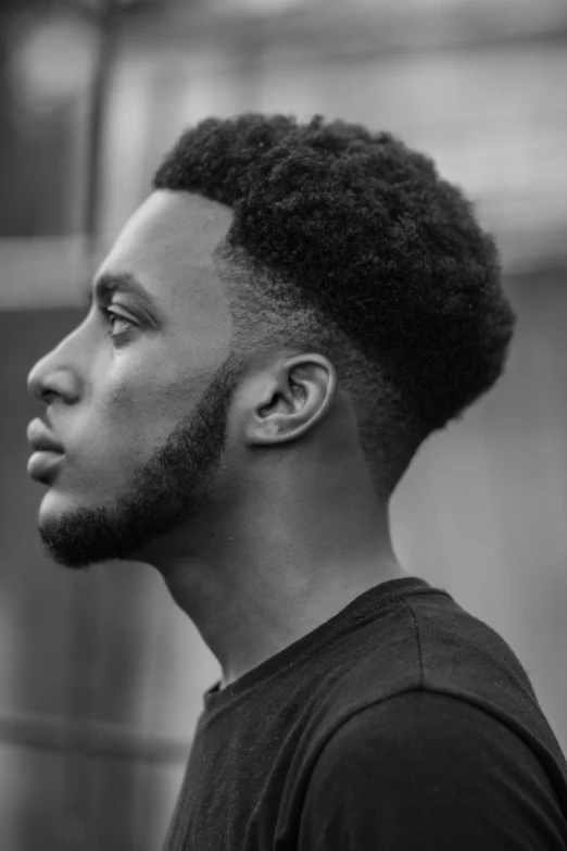 a black and white photo of a man with a afro, inspired by Xanthus Russell Smith, side profile centered, a handsome man，black short hair, square, jaylen brown