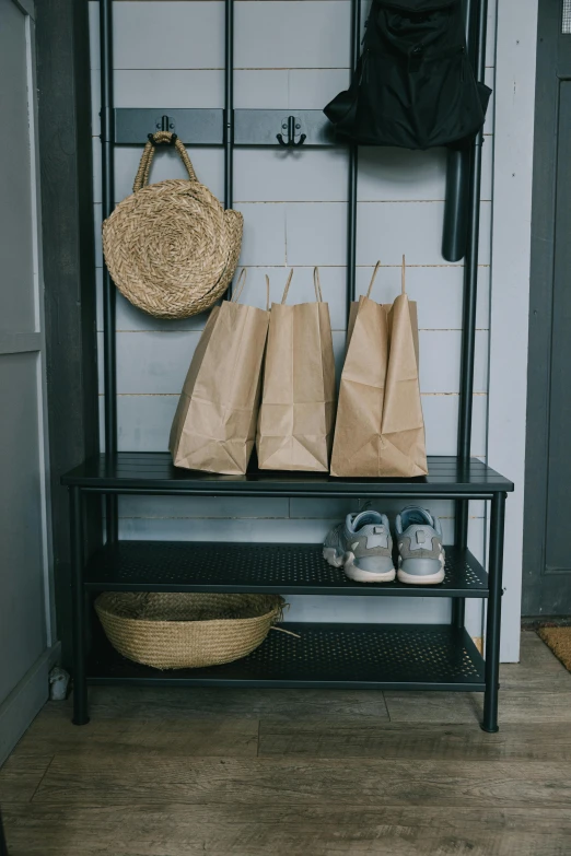 a bunch of bags sitting on a shelf in a room, pexels contest winner, private press, brown paper, seasonal, tall entry, matte black paper