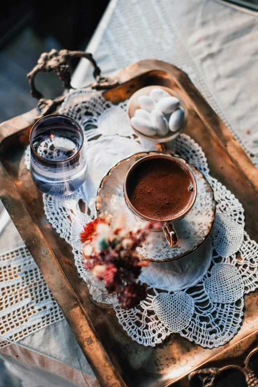 a tray that has a cup of coffee on it, a still life, pexels contest winner, hurufiyya, boho style, turkey, chocolate, outdoors mesa setting