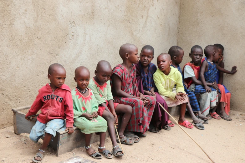 a group of children sitting next to each other, by Dietmar Damerau, pexels contest winner, hurufiyya, very kenyan, full body image, 15081959 21121991 01012000 4k