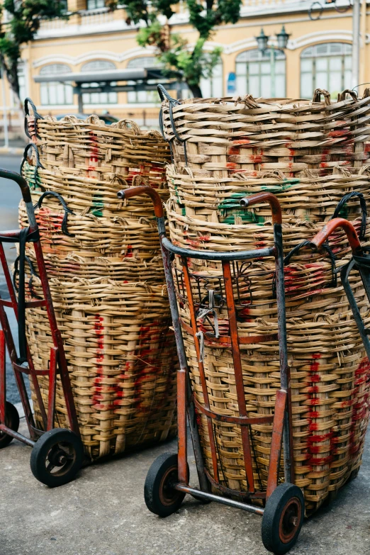 a couple of baskets sitting on top of a cart, in barcelona, stacked, stems, patterned