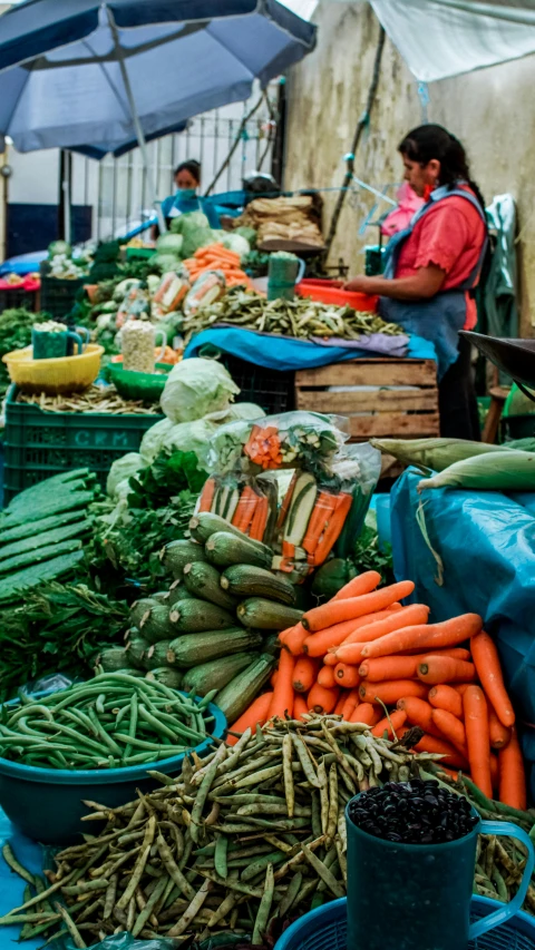 a table filled with lots of different types of vegetables, unsplash, peru, square, marketplace, tall