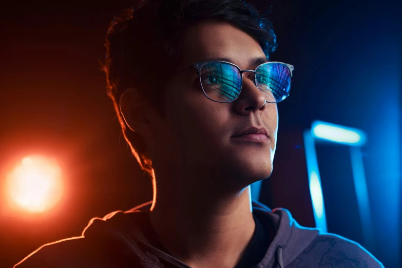 a close up of a person wearing glasses, inspired by Nathan Oliveira, rgb ethereal lighting, discord profile picture, shot with sony alpha, khyzyl saleem