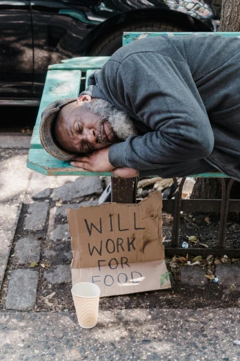 a homeless man sleeping on a park bench, a photo, by Will Ellis, trending on unsplash, renaissance, samuel l jackson posing in cafe, starving artist wearing overalls, 9 / 1 1, broken signs