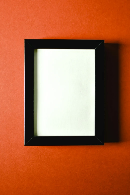 an empty picture frame on an orange wall, a cartoon, by Joseph Raphael, pexels, black lacquer, wooden casing, black white red, light box