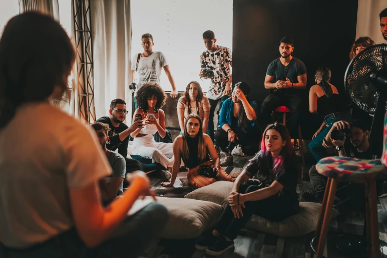 a group of people sitting and standing in a room, trending on unsplash, happening, pokimane, college party, charlie bowater and artgeem, sao paulo