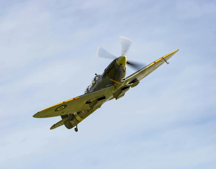 a yellow and black airplane flying through a blue sky, a portrait, by David Simpson, pexels contest winner, hurufiyya, spitfire, mid - action, slide show, panel