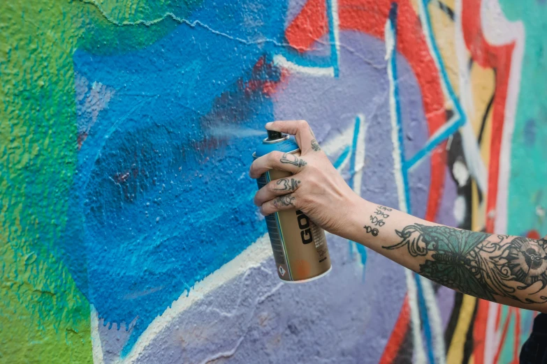 a person spraying graffiti on a wall with a spray can, molotow premium color palette, yoko d'holbachie, grey, thumbnail