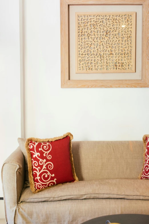 a living room with a couch and a coffee table, inspired by Riad Beyrouti, visual art, fine details. red, burlap, detail shot, etched relief