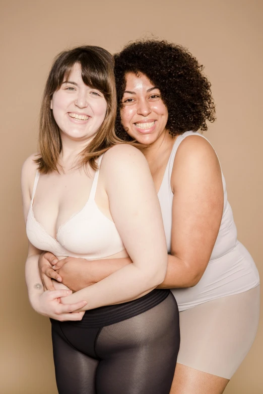 a couple of women standing next to each other, silicone skin, slightly overweight, promo image, large)}]