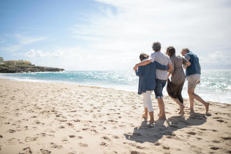 a group of people standing on top of a sandy beach, on the sand, profile image