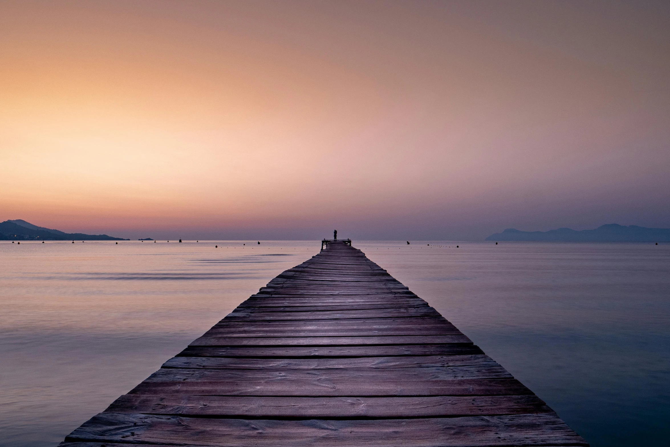 a long dock in the middle of a body of water, pexels contest winner, romanticism, faded glow, greece, meditation, trailing off into the horizon