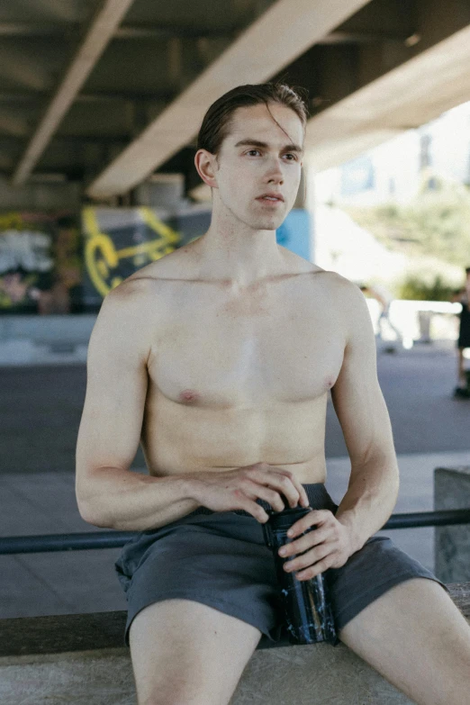 a man sitting on a bench with a bottle of beer, unsplash, realism, wearing tank top, very pale skin, athletic body build, gif