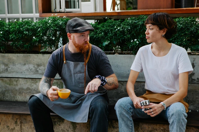 a man and a woman sitting on a bench, a portrait, by Lee Loughridge, pexels contest winner, starbucks aprons and visors, lachlan bailey, vannessa ives, two cups of coffee