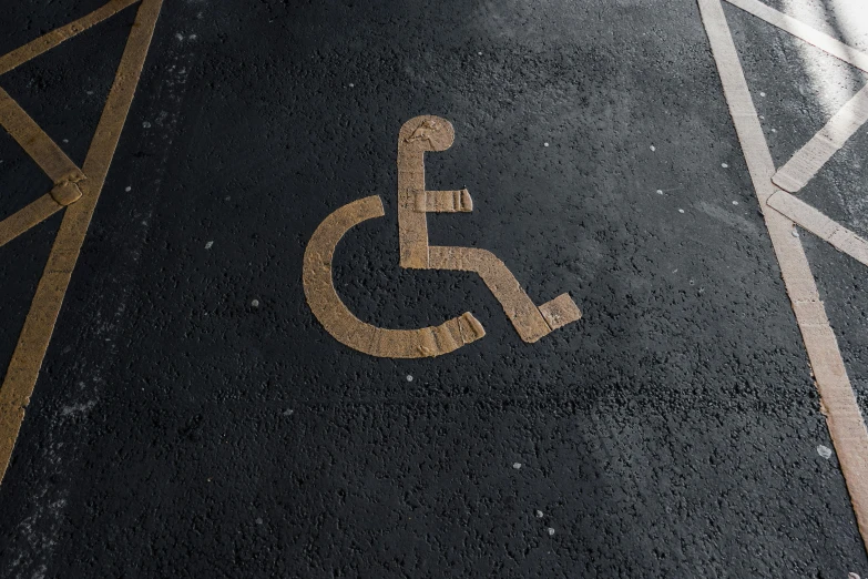 a handicap sign on the floor of a parking lot, an album cover, unsplash, graffiti, square, paul barson, paisley, hd detailed texture