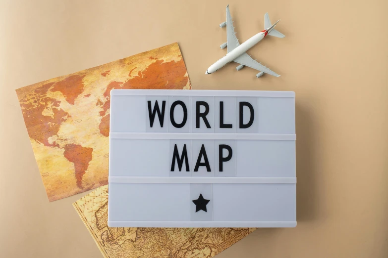 a sign that says world map next to a plane, a jigsaw puzzle, by Julia Pishtar, international typographic style, tactile buttons and lights, lightbox, beige, thumbnail