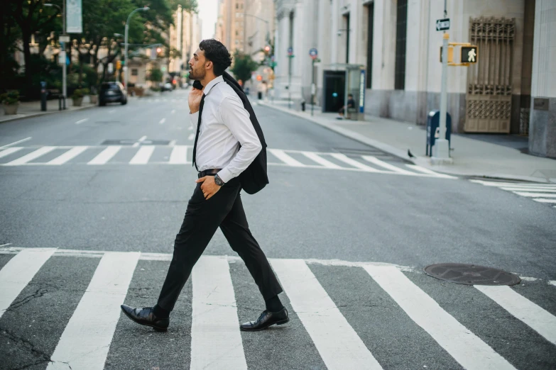 a man walking across a street while talking on a cell phone, pexels contest winner, renaissance, office clothes, new york streets, youtube thumbnail, wearing tuxedo