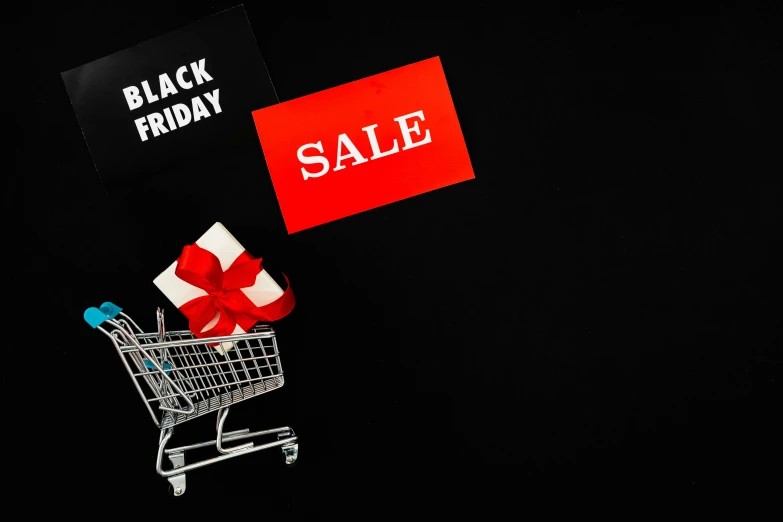 a shopping cart with a black friday sale sign next to it, pexels, hurufiyya, thumbnail, presents, black background, ribbon