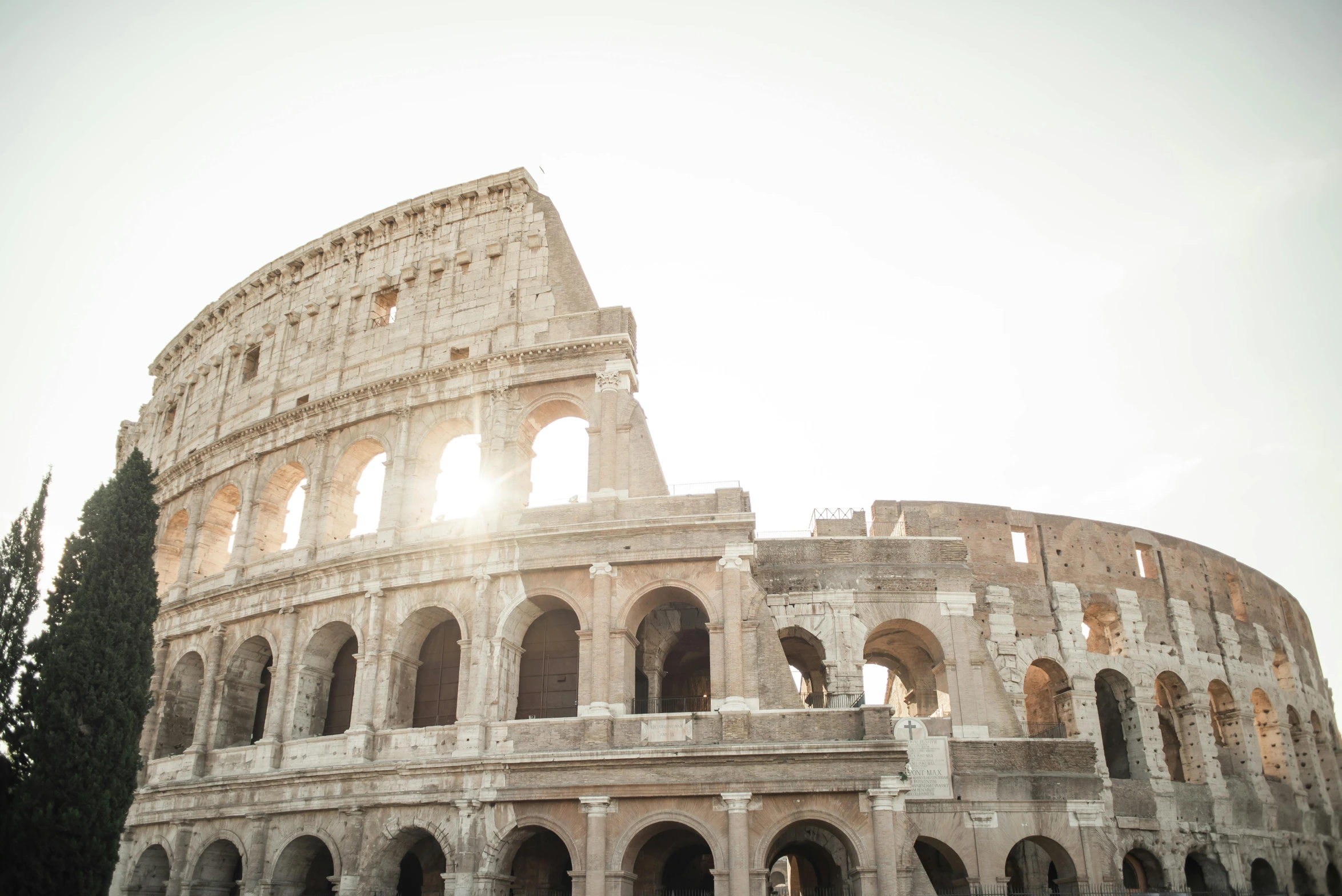 a group of people standing in front of the colossion, pexels contest winner, neoclassicism, colosseum, golden hour sunlight, profile image, rounded architecture