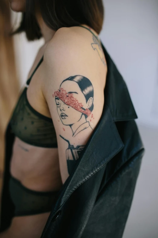 a woman with a tattoo on her arm, a tattoo, by Gavin Hamilton, hair covering eyes, in kaethe butcher, temporary tattoo, red ink