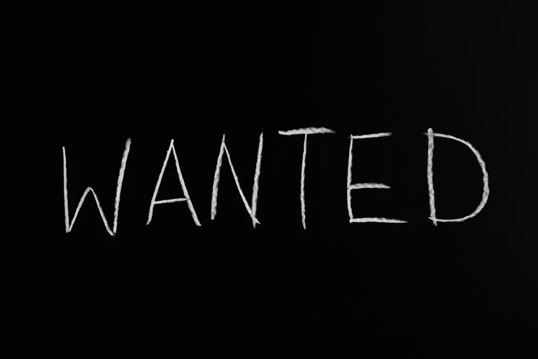 a blackboard with the word wanted written on it, pexels, very detailed. 4 k, unsettling found footage, white font on black canvas, profile picture 1024px
