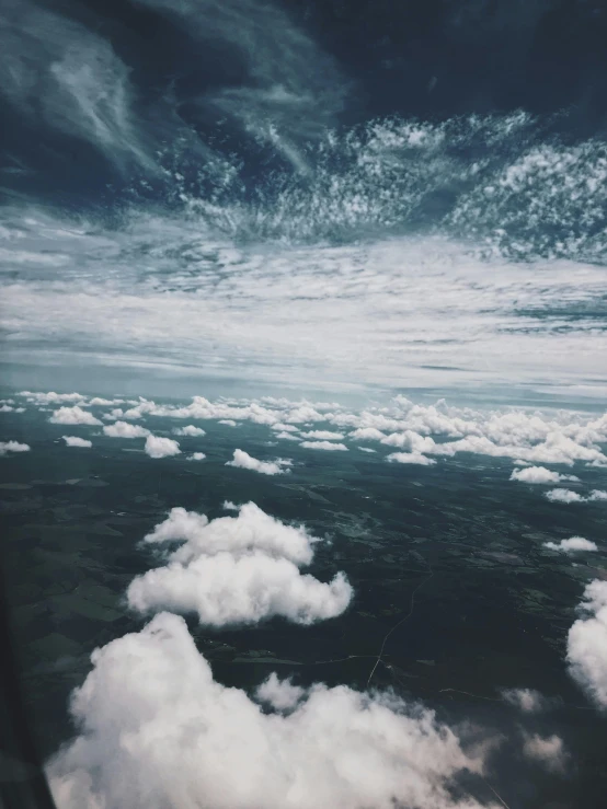 a view of the sky from an airplane window, trending on unsplash, surrealism, ☁🌪🌙👩🏾, low angle photo, multiple stories, extremely high details