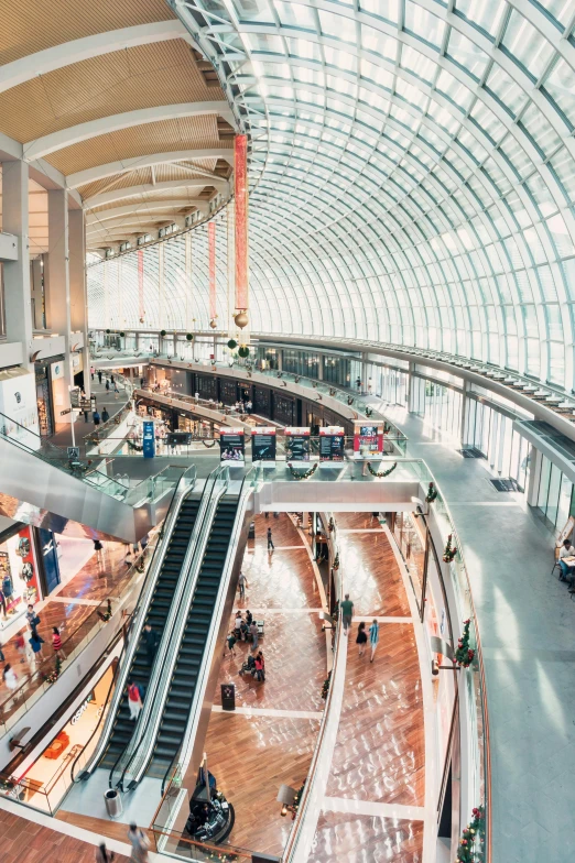 a couple of escalators that are inside of a building, the city of toronto, people shopping, geodesic building, flat lay