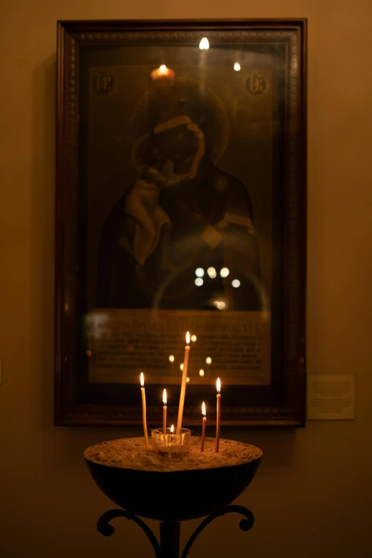 a group of lit candles sitting on top of a table, iconostasis in the bar, museum light, photograph, pray