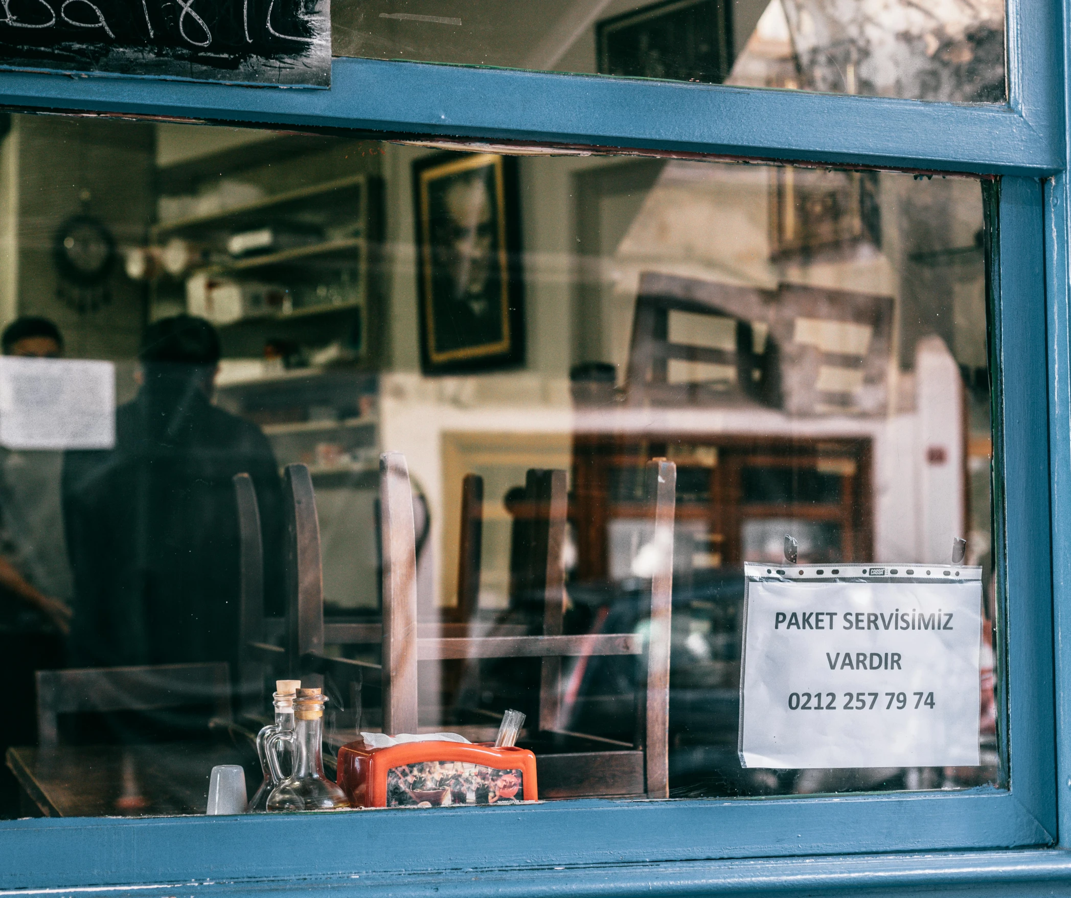 there is a sign in the window of a barber shop, a portrait, pexels contest winner, visual art, very smoky paris bar, crafts and souvenirs, an escape room in a small, a handsome