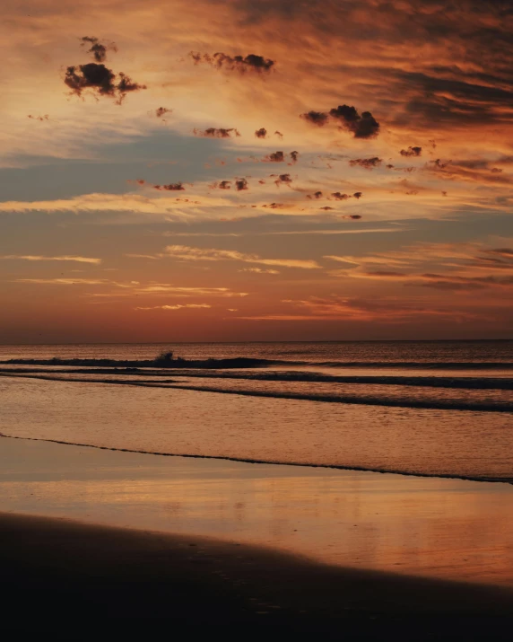 a person holding a surfboard on a beach at sunset, by Charlotte Harding, unsplash contest winner, romanticism, sunset panorama, lgbtq, instagram story, red skies